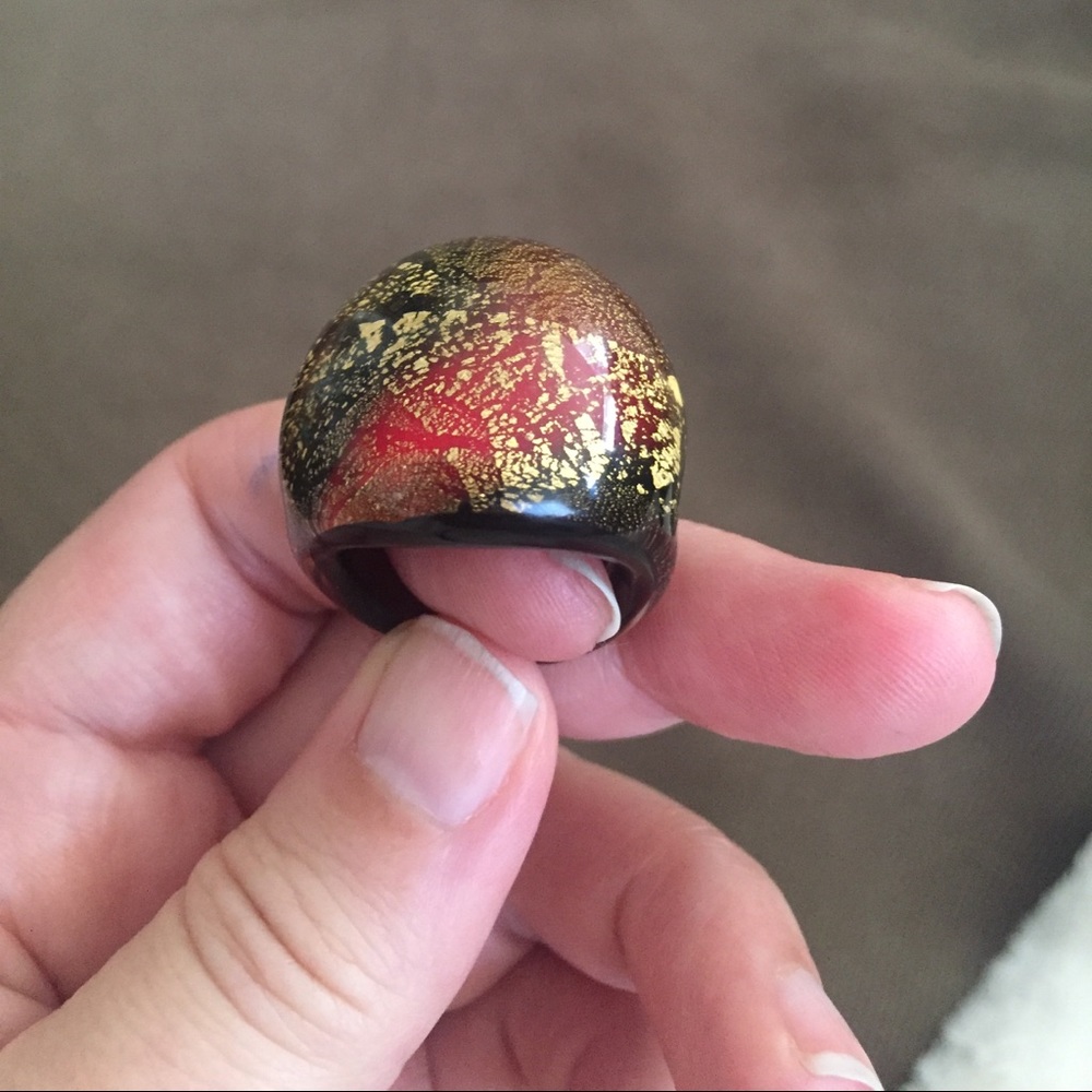 Red, black and gold glass ring